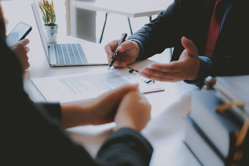 Legal consultation with attorney discussing injury claim and settlement options.