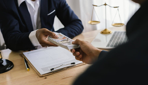 Lawyers negotiating legal settlements and financial agreements for injury and foreclosure cases.