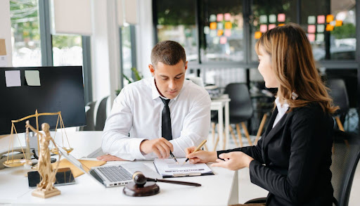 Criminal defense lawyer consulting with client on legal strategy and options.