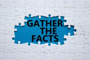 White puzzle pieces with the words 'Gather the facts' on them, set against a vibrant blue background. Business and investigative concept.