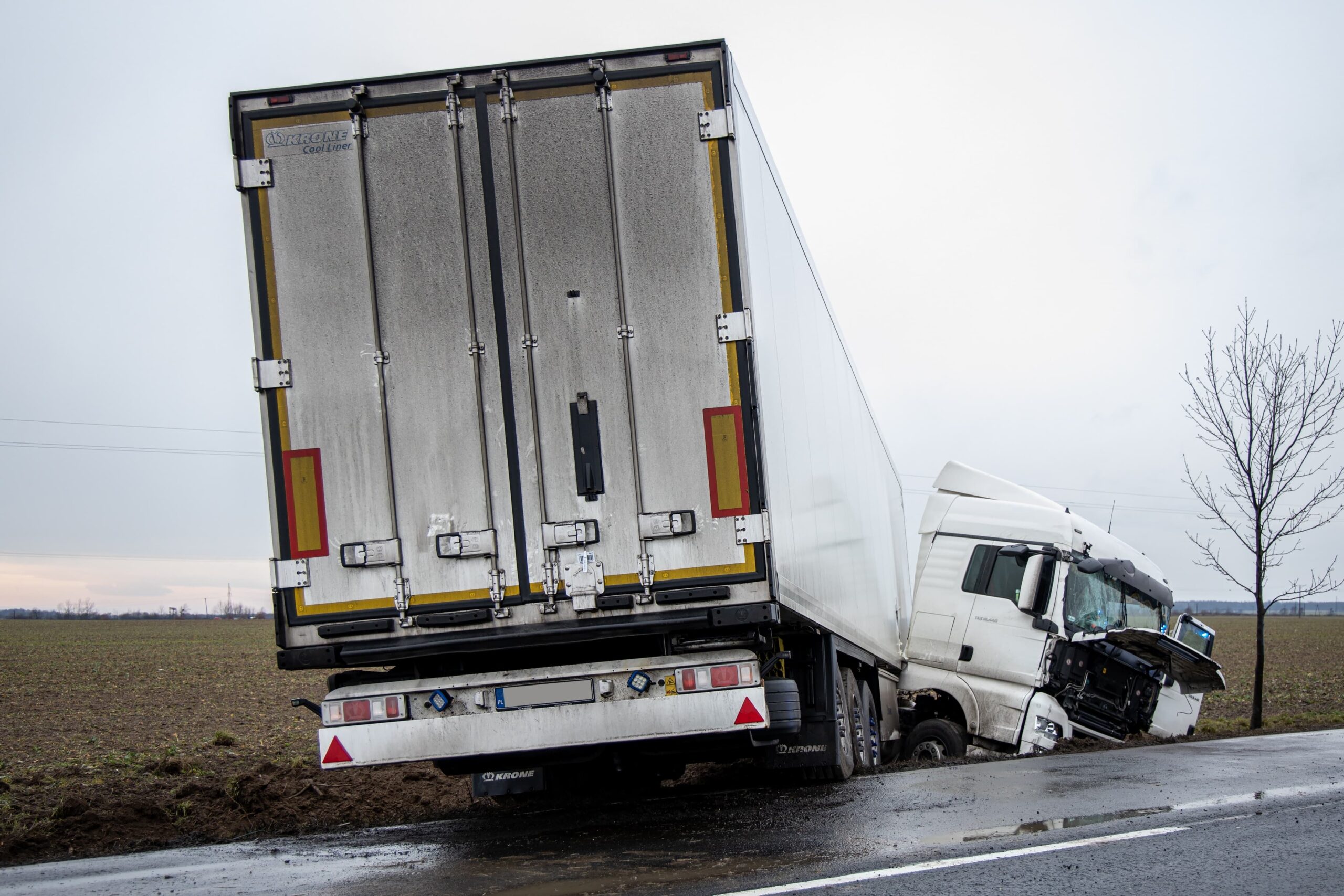 Damaged white truck with a semi-trailer that drove off the road and into a ditch in Gotartow, Poland on December 29, 2020